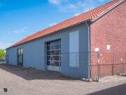 Eén van de oudste panden in de St Bavostraat in de grijper